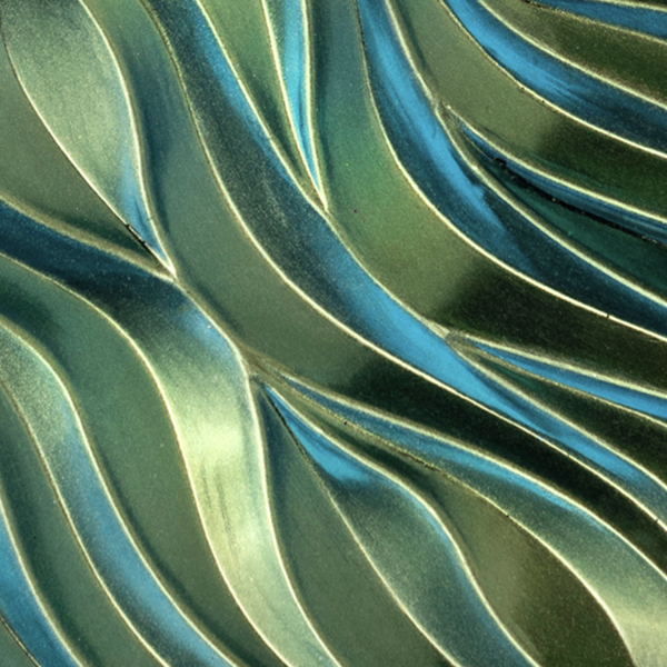 Close-up of wavy, metallic green surface