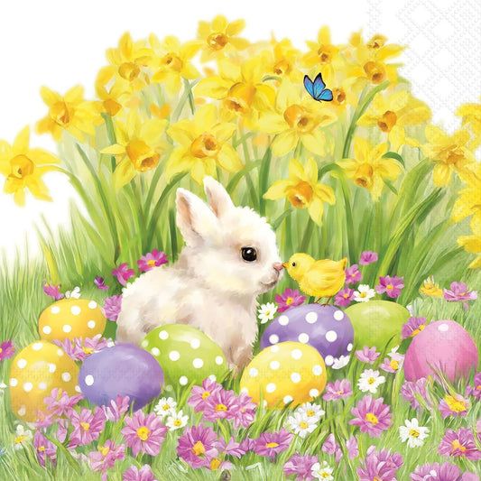 White rabbit among Easter eggs and flowers with a butterfly.