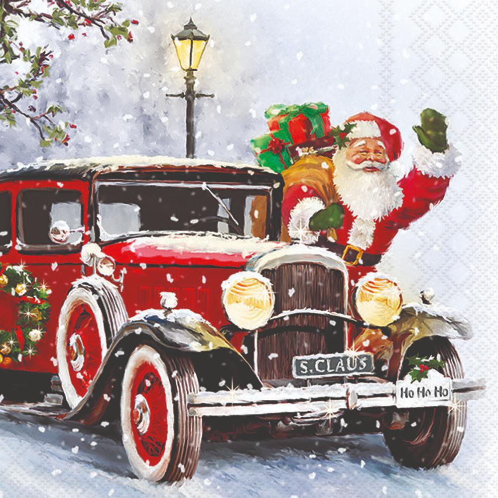 Santa waving from a vintage red car in the snow.