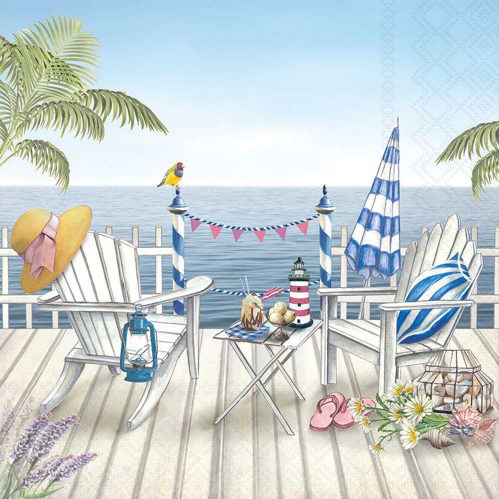 Seaside scene with beach chairs, umbrella, and table with snacks on a deck.
