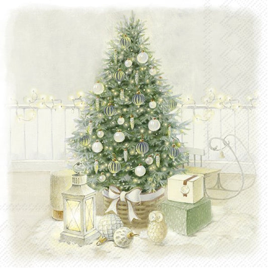 Decorated Christmas tree with ornaments and presents in a softly lit room.