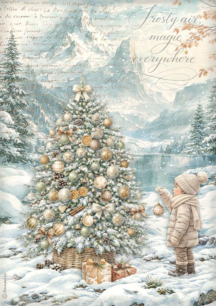 A festive winter landscape illustration showing a snow-covered Christmas tree decorated with gold and cream ornaments, beside a child in a beige winter coat and hat reaching toward the tree. Snow, mountains, trees, and a lake are visible in the background, with cursive text reading 'Frosty air, magic everywhere.