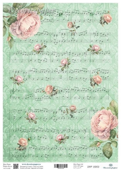 A sheet of decorative paper featuring a vintage design with pink roses, green leaves, and musical notes on a light mint green background.
