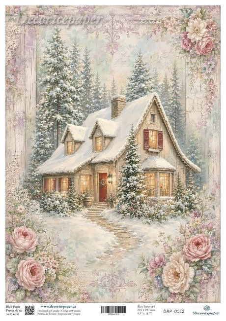 A vintage-style winter cottage scene printed on a decorative paper sheet, showing a snow-covered house with warm glowing windows, evergreen trees, and large pink roses around the border. 