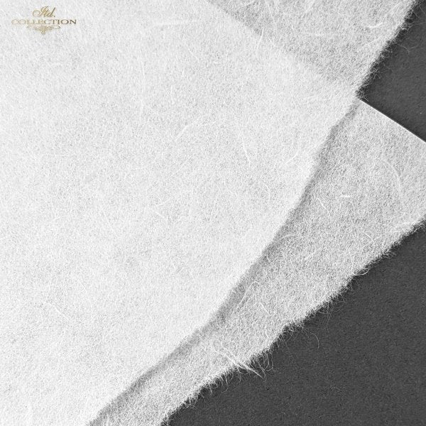 A close-up of a white textured rice paper  with a soft, fuzzy surface, layered diagonally over a dark grey background. 