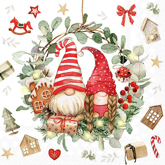 A festive Christmas wreath illustration featuring two gnomes, evergreen branches, red berries, ornaments, stars, candy canes, and small houses on a white background.