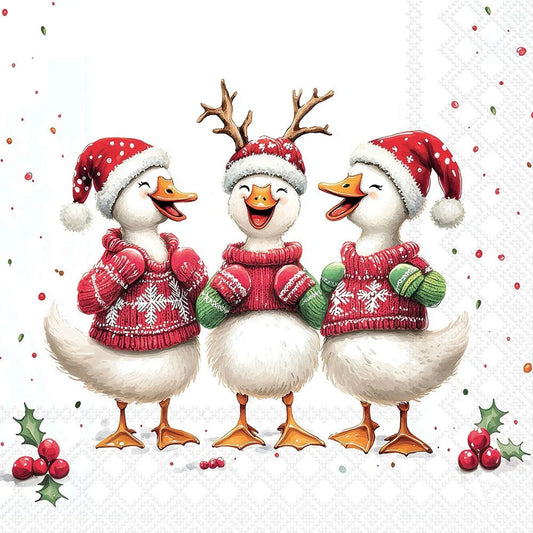Three festive white ducks wearing red Santa hats and knitted holiday sweaters, standing together on a white patterned background with small red berries and holly accents.