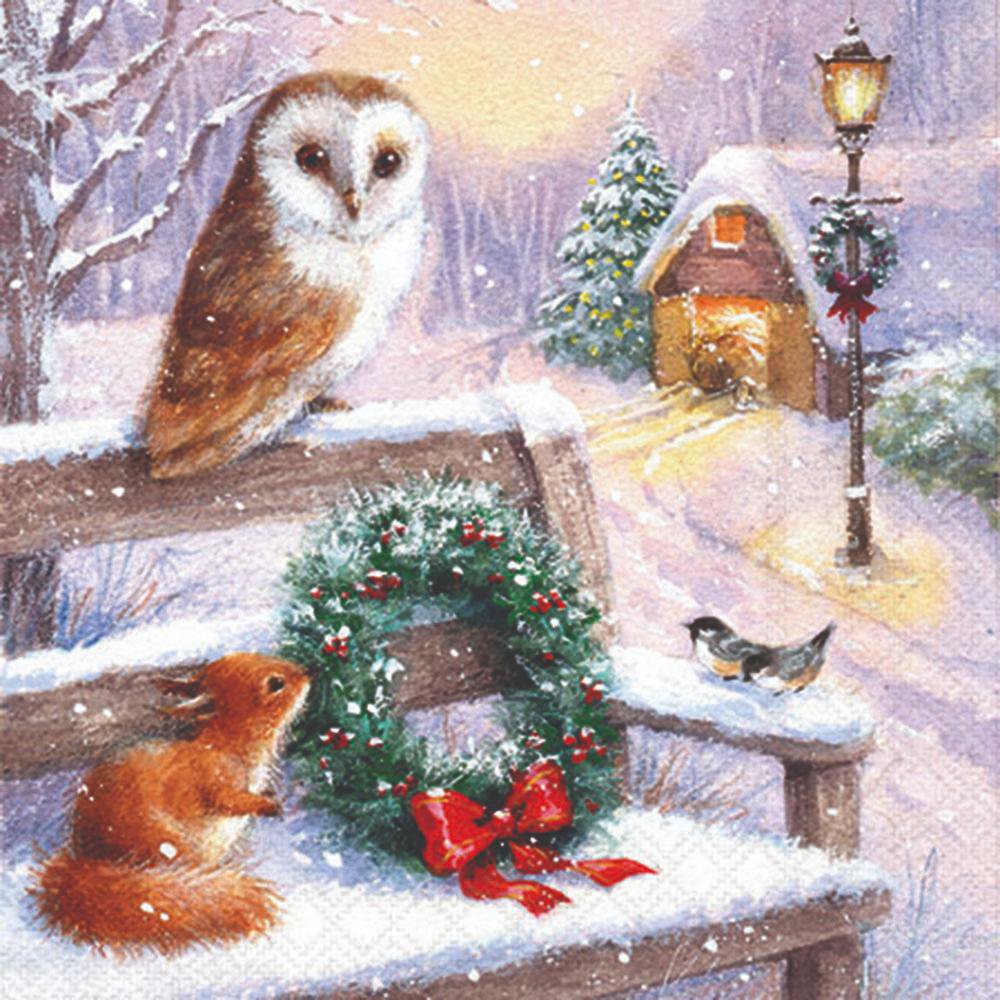 Owl,squirrel, and birds on a snowy bench with a Christmas wreath.