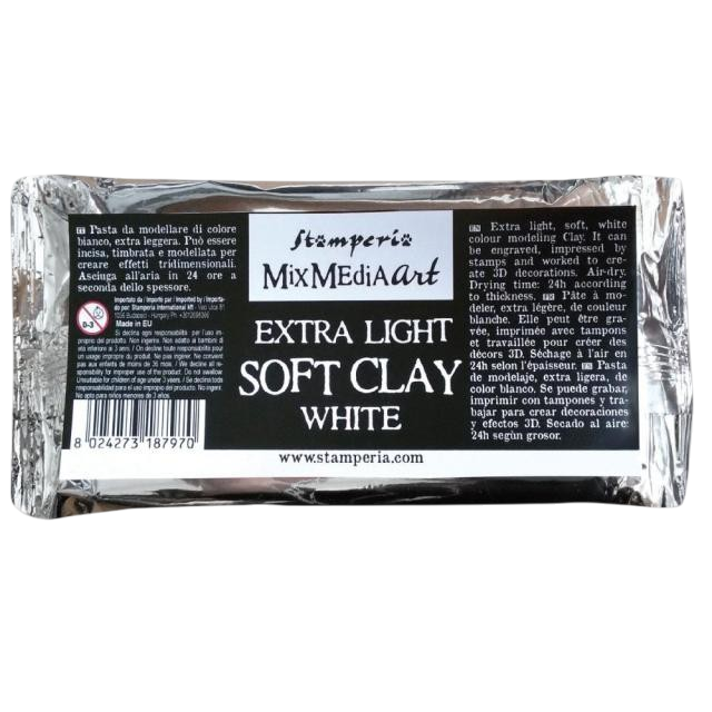 A package of Stamperia MixMediArt Extra Light Soft Clay White modeling clay, wrapped in reflective silver foil with a black and white label.