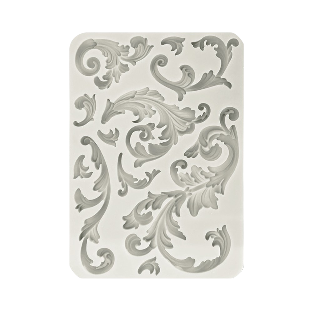 A rectangular silicone mold with a raised baroque scroll and acanthus leaf pattern.