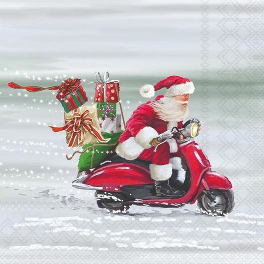 Santa Claus riding a red scooter with gifts on a snowy background