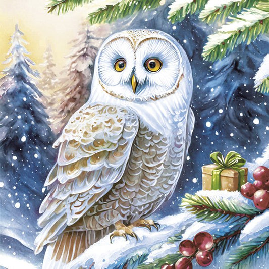 White owl in a snowy landscape with Christmas elements