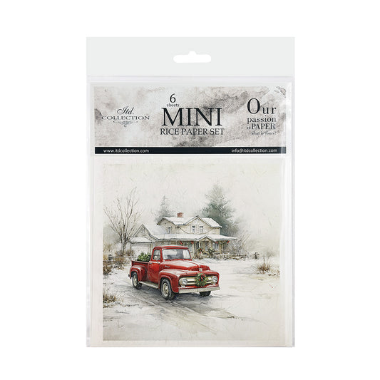A packaged paper craft set labeled 'Mini Rice Paper Set' with a printed winter scene showing a red pickup truck parked in front of a house in the snow. The package is photographed on a plain white background.