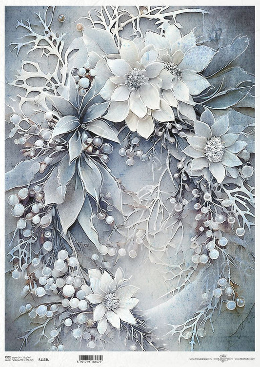 Decorative paper cutout of flowers and branches with a light blue background