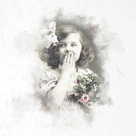 Vintage-style photo of a young girl with flowers, framed with soft, blurred edges.