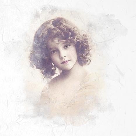 Vintage-style portrait of a young girl with soft focus and light background