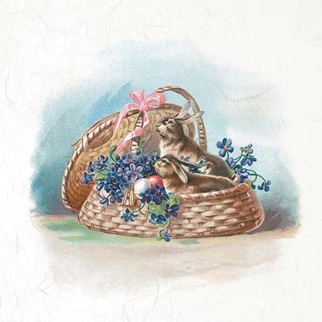 Two rabbits in a wicker basket with flowers and a pink bow on a light background
