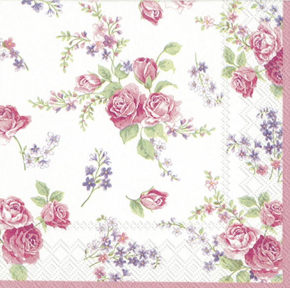 Floral patterned paper napkin with pink roses and green leaves on a white background