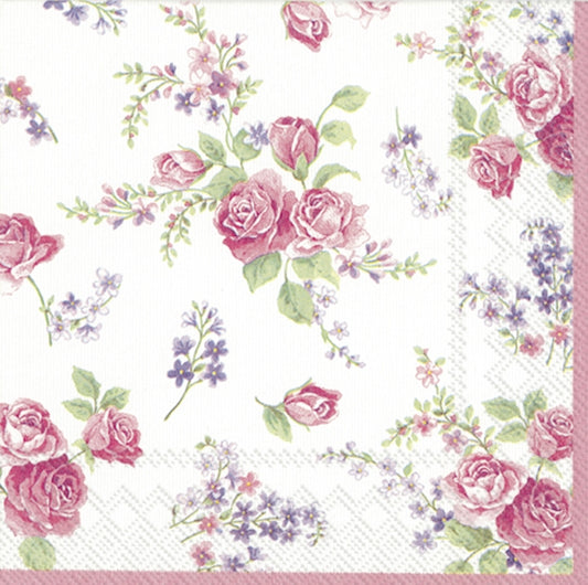 Floral patterned paper napkin with pink roses and green leaves on a white background