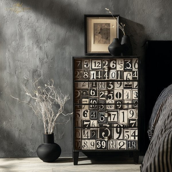 Cabinet with number-themed design against a gray wall