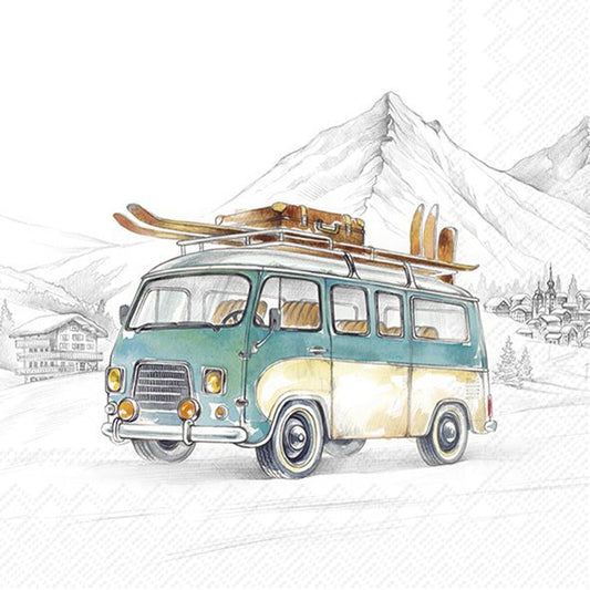 Vintage van with skis on a snowy landscape