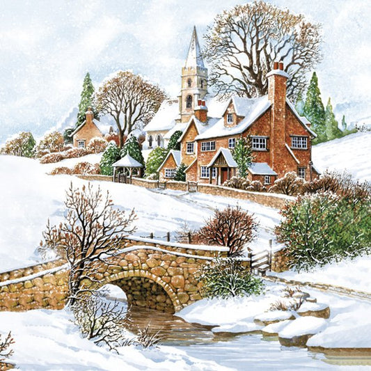Snowy village scene with a church, houses, and a bridge over a stream.