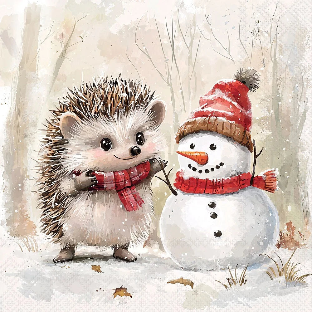 A watercolor-style winter illustration showing a small hedgehog in a red plaid scarf standing beside a snowman wearing a red and brown hat and matching scarf, with a soft snowy forest background.