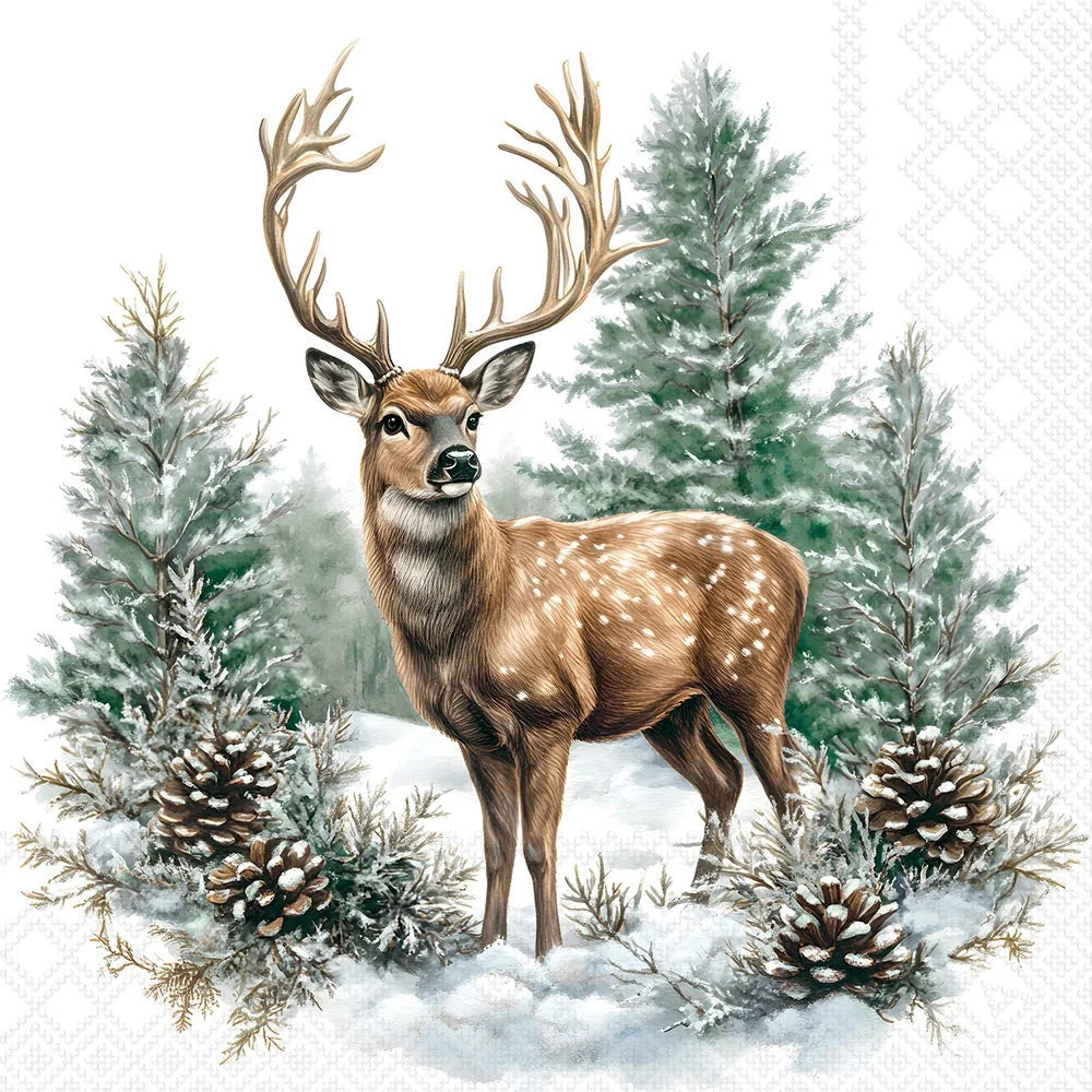 A deer with large antlers standing in snowy ground among evergreen trees and pinecones, printed on a white patterned surface that appears to be a napkin or paper product.