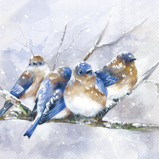 Four birds perched on a branch in a snowy landscape